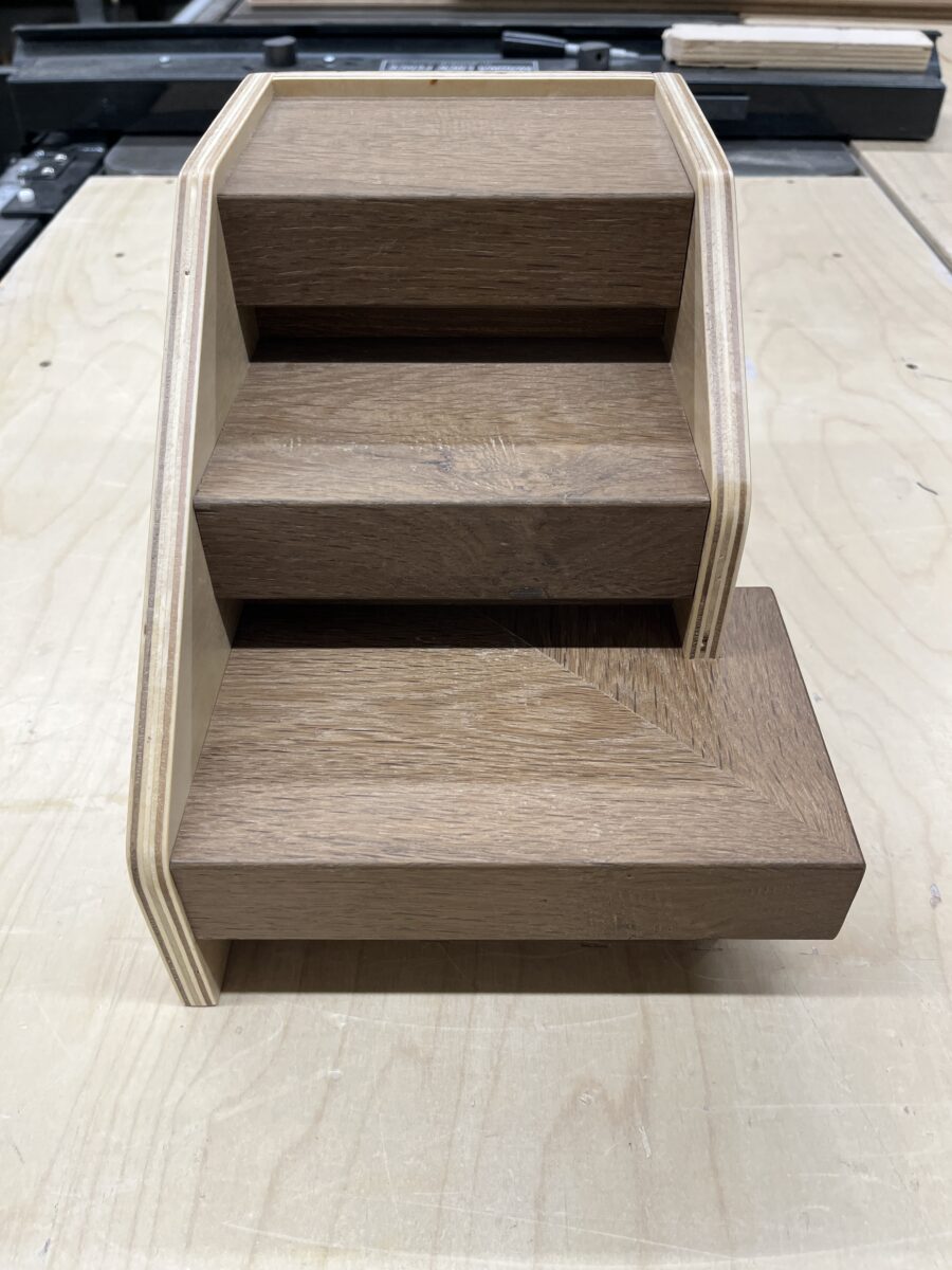 Full display view of hardwood sample staircase used for showroom and dealer presentations.