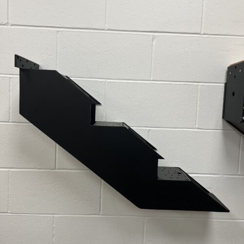 Black steel mono-stringer staircase frame with a plate-less design and hidden fastening for a sleek, minimal appearance.